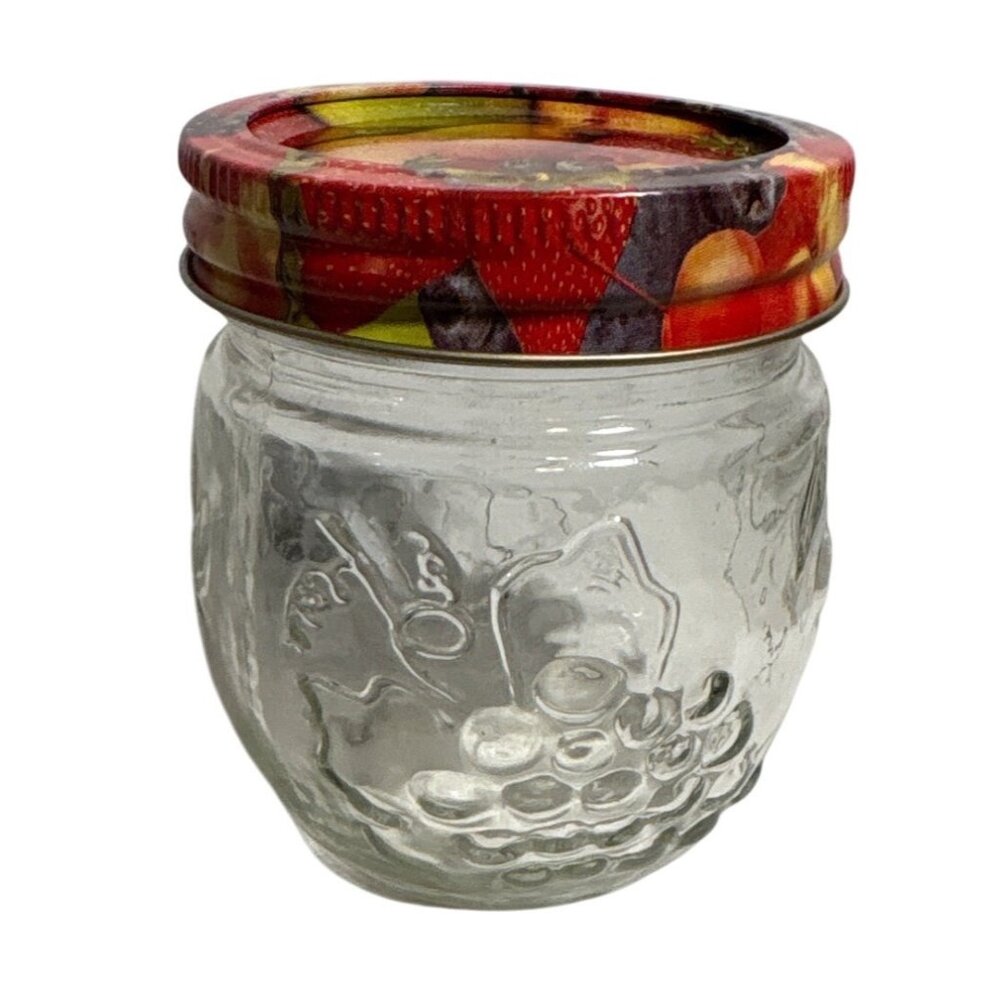 Small Glass Jar With Fruit Print Lid Embossed Fruit Design 3.5 Inches Tall  Jam